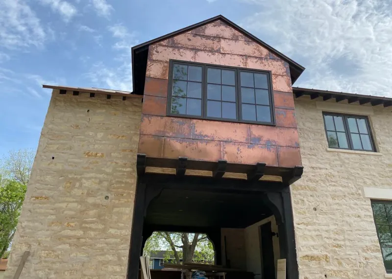 Copper metal panel facade on a stone building for Skylight Installation in Hillcrest Heights