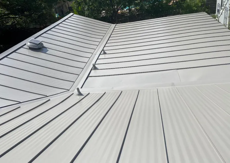 Solar attic fan installed on a metal roof for Roof Ventilation in Hillcrest Heights